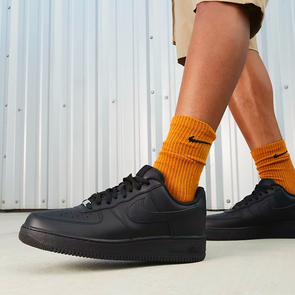 Nike Black Sneakers with Thick White Sole and Low-Top Design